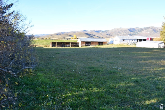 114 W 7th St, Georgetown, ID 83239 - view of yard featuring a mountain view, an outbuilding, and a view of countryside