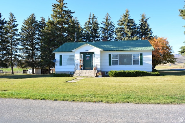 114 W 7th St, Georgetown, ID 83239 - view of front of home with a front lawn and a metal roof