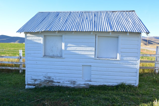 114 W 7th St, Georgetown, ID 83239 - view of side of property featuring a metal roof, an outbuilding, and a mountain view