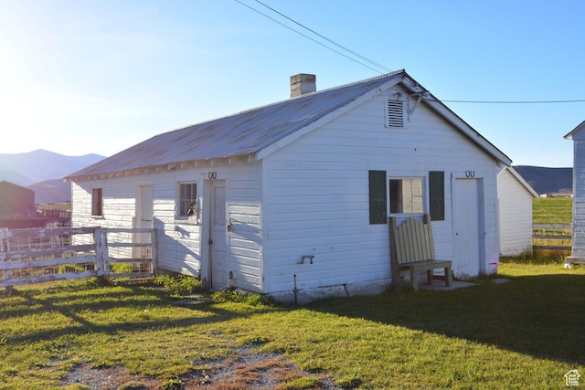 114 W 7th St, Georgetown, ID 83239 - back of property featuring a chimney and a metal roof