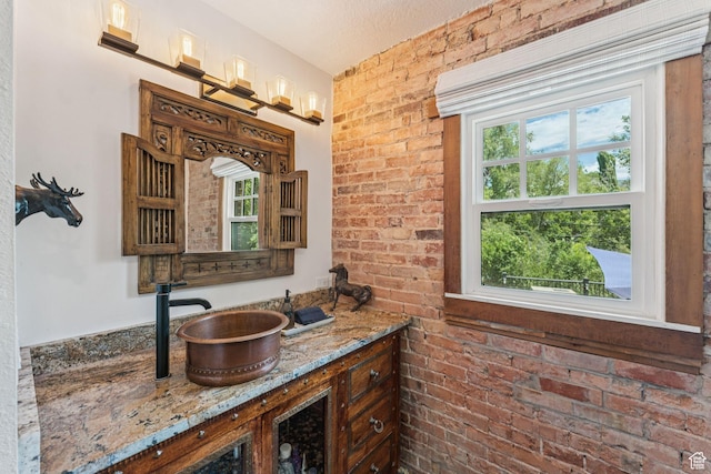 1710 E 900 S, Salt Lake City, UT 84108 - bathroom with plenty of natural light, vanity, and brick wall