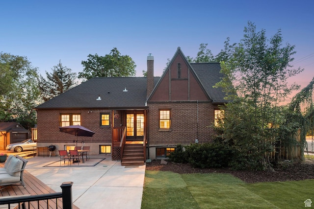 1710 E 900 S, Salt Lake City, UT 84108 - back of property featuring brick siding, a patio, a chimney, outdoor dining area, and a yard