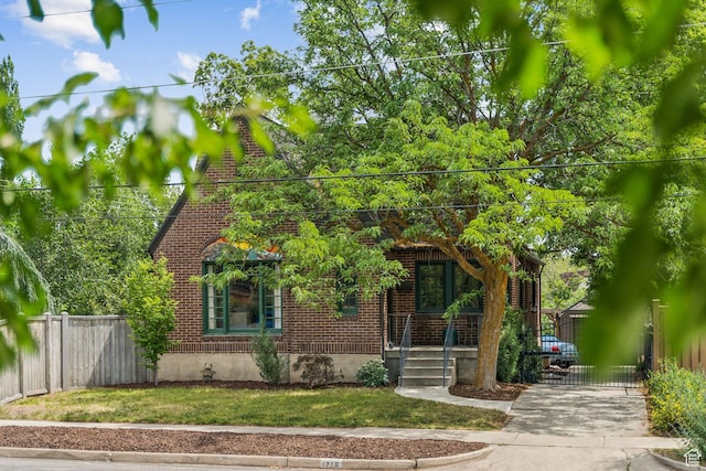 1710 E 900 S, Salt Lake City, UT 84108 - view of front of property featuring brick siding, a gate, and covered porch