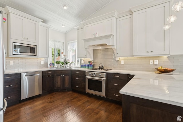 3922 View Pointe Dr, Park City, UT 84098 - kitchen featuring stainless steel appliances, lofted ceiling, white cabinets, dark wood-type flooring, and dark brown cabinets