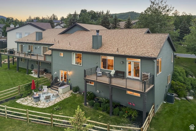3922 View Pointe Dr, Park City, UT 84098 - back of property with an outdoor fire pit, a patio area, a fenced backyard, a chimney, and a shingled roof