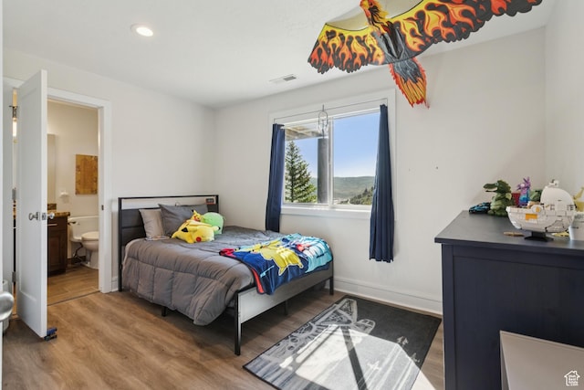 3922 View Pointe Dr, Park City, UT 84098 - bedroom with wood finished floors, ensuite bath, and recessed lighting