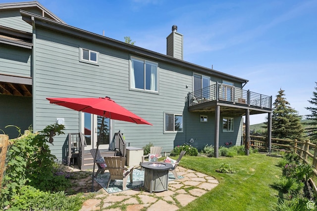 3922 View Pointe Dr, Park City, UT 84098 - rear view of house with a balcony, an outdoor fire pit, a chimney, and a patio area