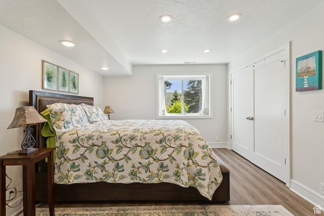 3922 View Pointe Dr, Park City, UT 84098 - bedroom with wood finished floors, recessed lighting, and a textured ceiling