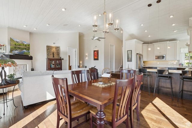 3922 View Pointe Dr, Park City, UT 84098 - dining room featuring dark wood finished floors, recessed lighting, lofted ceiling, and a chandelier
