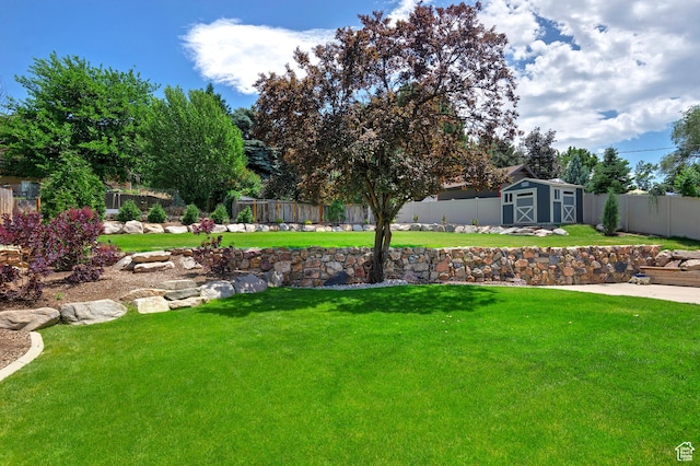 7669 S 1130 E, Midvale, UT 84047 - fenced backyard with a storage unit