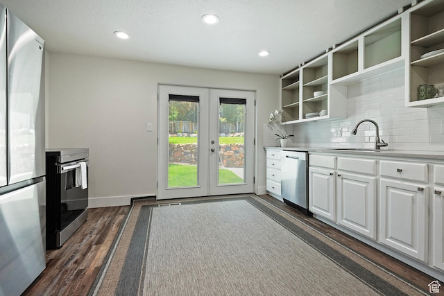 7669 S 1130 E, Midvale, UT 84047 - kitchen with appliances with stainless steel finishes, open shelves, dark wood-style flooring, french doors, and recessed lighting