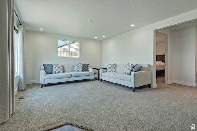 7669 S 1130 E, Midvale, UT 84047 - living room with carpet, recessed lighting, and a textured ceiling