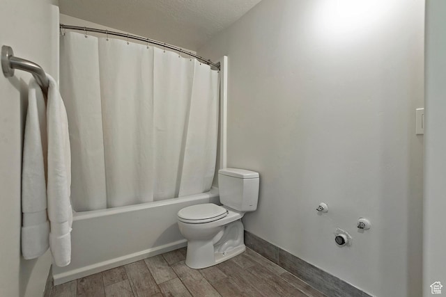 7669 S 1130 E, Midvale, UT 84047 - full bathroom featuring wood finished floors and shower / bath combo with shower curtain