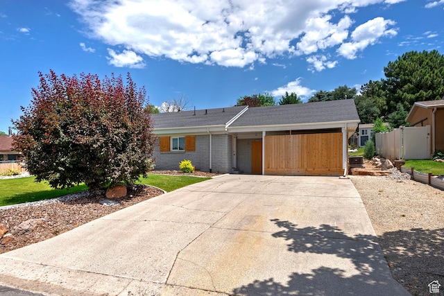 7669 S 1130 E, Midvale, UT 84047 - view of front of house with concrete driveway and brick siding