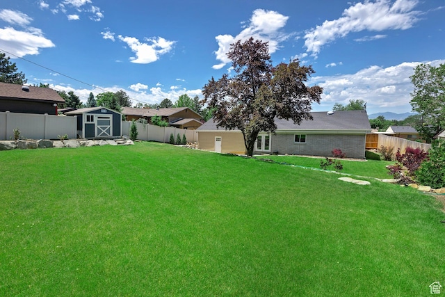 7669 S 1130 E, Midvale, UT 84047 - fenced backyard with a shed and french doors