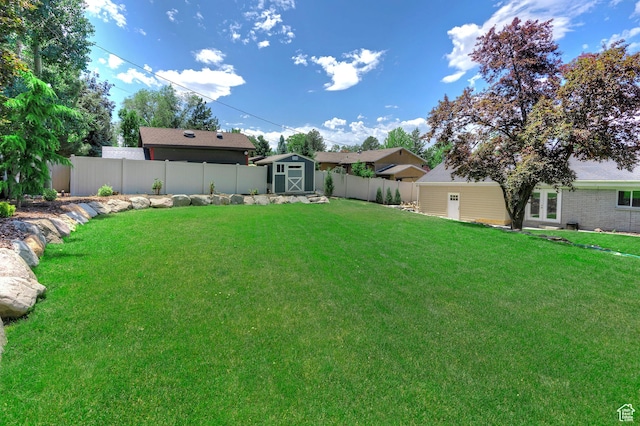 7669 S 1130 E, Midvale, UT 84047 - fenced backyard featuring a shed and french doors