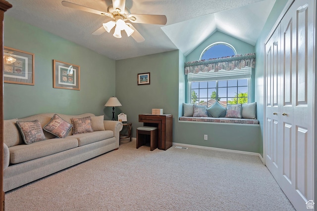 1222 E Big Pine Cir, Sandy, UT 84094 - living area featuring carpet floors, a ceiling fan, vaulted ceiling, and a textured ceiling