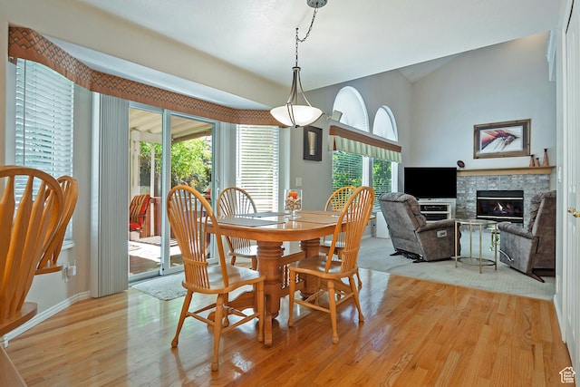 1222 E Big Pine Cir, Sandy, UT 84094 - dining area with light wood-type flooring and a glass covered fireplace