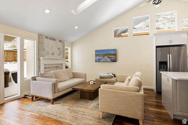 3569 E Avondale Dr S, Cottonwood Heights, UT 84121 - living area with dark wood finished floors, a fireplace, recessed lighting, high vaulted ceiling, and a skylight