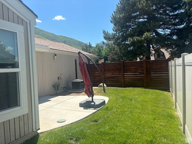3569 E Avondale Dr S, Cottonwood Heights, UT 84121 - fenced backyard featuring a mountain view and a patio area