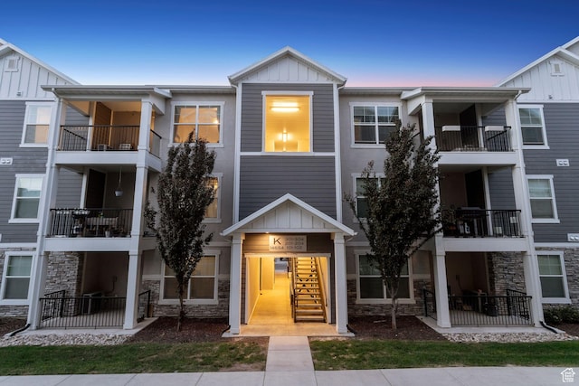 14654 S Bloom Dr W Unit K301, Herriman, UT 84096 - view of property with board and batten siding and stone siding