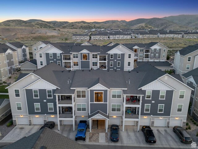 14654 S Bloom Dr W Unit K301, Herriman, UT 84096 - aerial view at dusk of a mountain view and a residential view