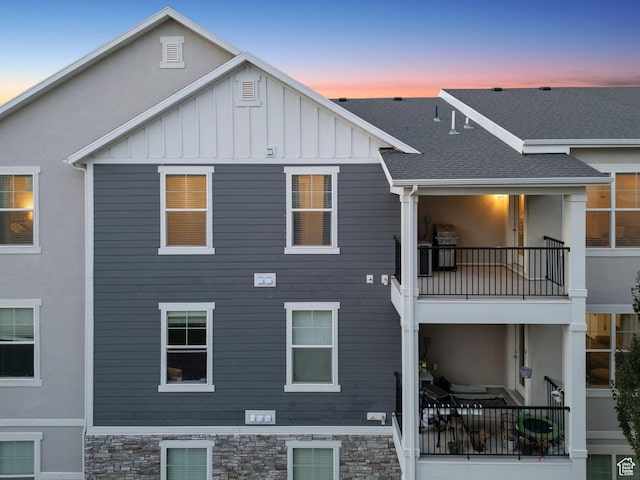 14654 S Bloom Dr W Unit K301, Herriman, UT 84096 - rear view of property with a balcony, board and batten siding, and a shingled roof