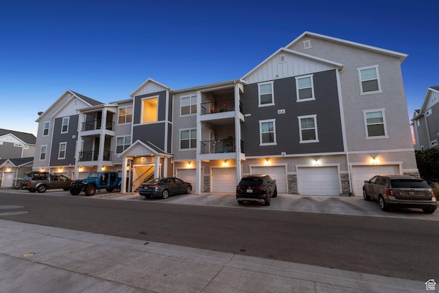 14654 S Bloom Dr W Unit K301, Herriman, UT 84096 - multi unit property with board and batten siding, a garage, driveway, and stone siding