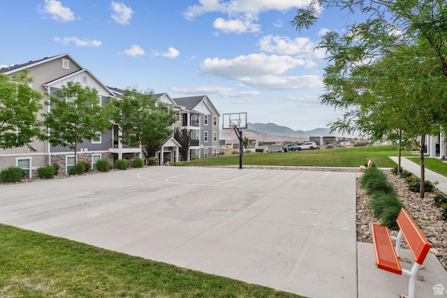 14654 S Bloom Dr W Unit K301, Herriman, UT 84096 - view of basketball court featuring community basketball court, a yard, a mountain view, and a residential view