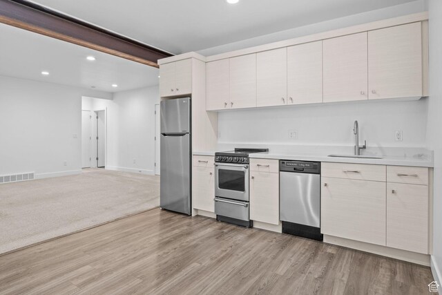 1046 W Albion Meadow Way, Bluffdale, UT 84065 - kitchen featuring stainless steel appliances, recessed lighting, light countertops, light wood-type flooring, and open floor plan