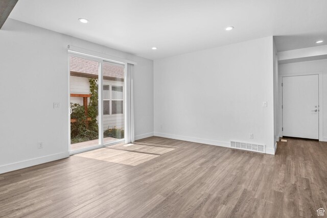 1046 W Albion Meadow Way, Bluffdale, UT 84065 - unfurnished room featuring wood finished floors and recessed lighting