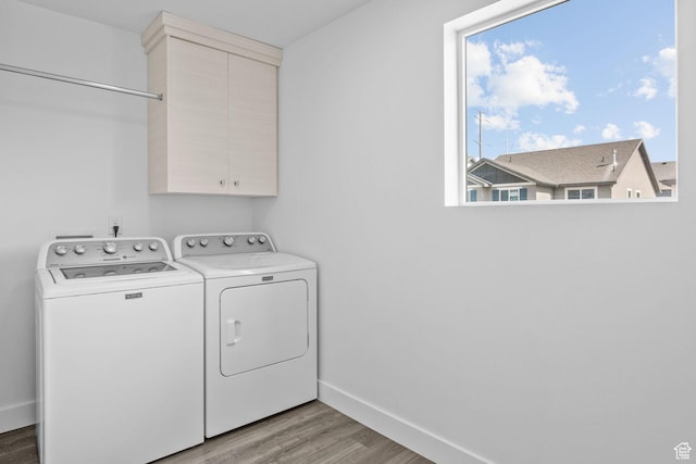 1046 W Albion Meadow Way, Bluffdale, UT 84065 - washroom featuring washing machine and clothes dryer, light wood-type flooring, and cabinet space