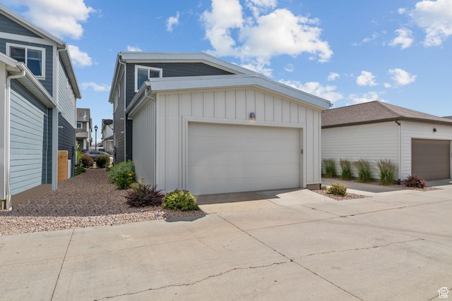 1046 W Albion Meadow Way, Bluffdale, UT 84065 - view of front of home with board and batten siding, a garage, and driveway