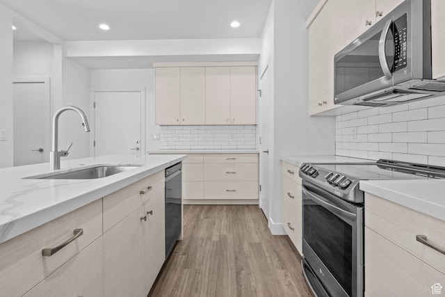 1046 W Albion Meadow Way, Bluffdale, UT 84065 - kitchen featuring stainless steel appliances, light wood-style flooring, decorative backsplash, recessed lighting, and light stone counters