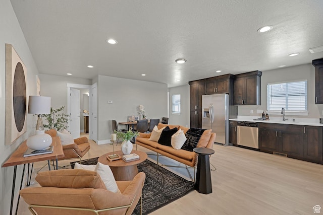 766 N 540 E, Smithfield, UT 84335 - living room with recessed lighting, light wood finished floors, and a textured ceiling