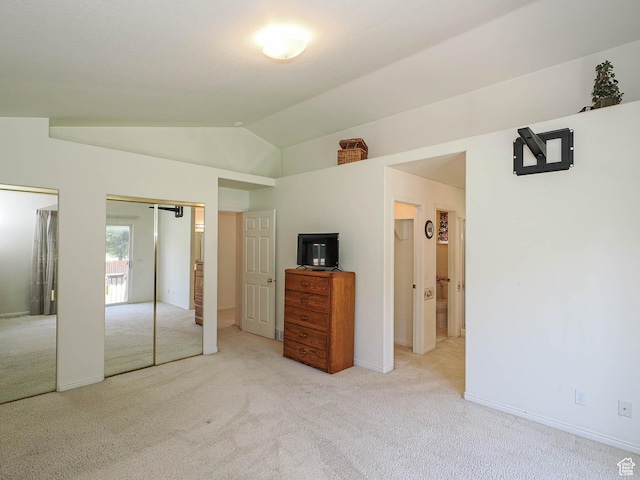 3988 W Sugar Beet Dr S, West Valley City, UT 84120 - unfurnished bedroom featuring two closets, light colored carpet, and lofted ceiling