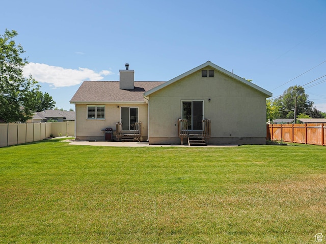 3988 W Sugar Beet Dr S, West Valley City, UT 84120 - rear view of house featuring a chimney, a fenced backyard, a patio, and entry steps
