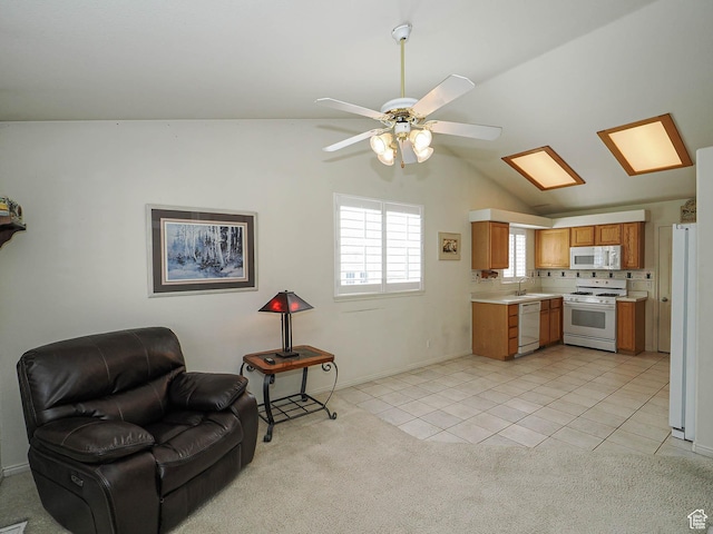 3988 W Sugar Beet Dr S, West Valley City, UT 84120 - kitchen with white appliances, light countertops, open floor plan, lofted ceiling, and ceiling fan
