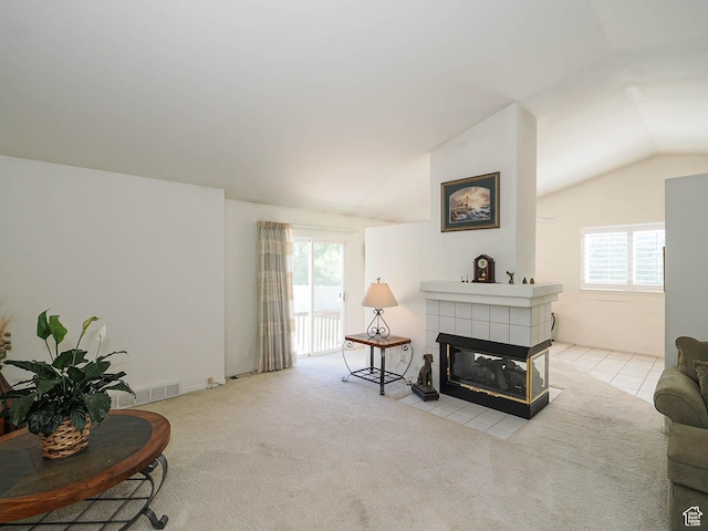 3988 W Sugar Beet Dr S, West Valley City, UT 84120 - living room featuring lofted ceiling, a tiled fireplace, and carpet