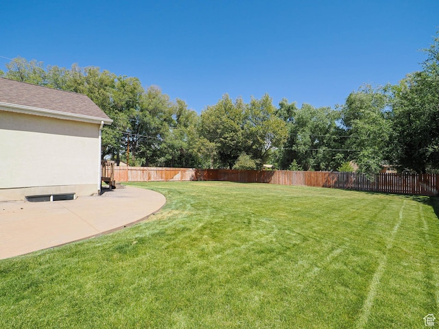 3988 W Sugar Beet Dr S, West Valley City, UT 84120 - fenced backyard featuring a patio and view of wooded area
