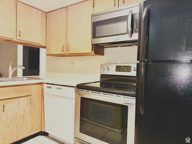 2000 Prospector Ave Unit 110, Park City, UT 84060 - kitchen featuring stainless steel appliances, light countertops, light tile patterned flooring, and light brown cabinetry