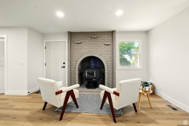 1655 W 2200 S, College Ward, UT 84339 - living area with a wood stove, light wood-style flooring, and recessed lighting