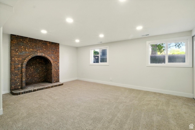 1655 W 2200 S, College Ward, UT 84339 - unfurnished living room featuring carpet flooring, recessed lighting, plenty of natural light, and a fireplace