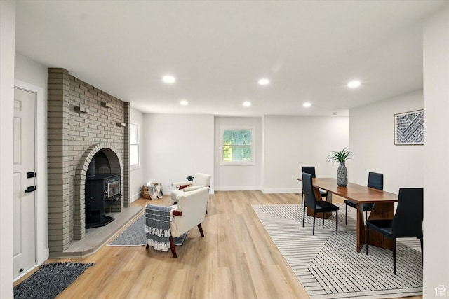1655 W 2200 S, College Ward, UT 84339 - living room with light wood-type flooring, recessed lighting, and a wood stove