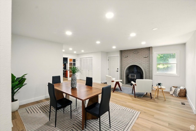 1655 W 2200 S, College Ward, UT 84339 - dining room featuring recessed lighting, light wood-style flooring, and a fireplace