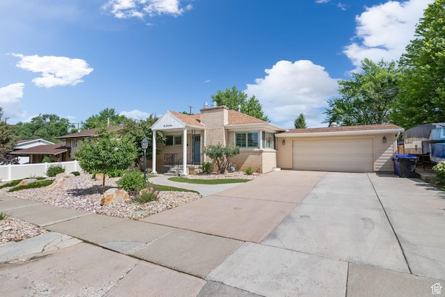 149 E 800 N, Bountiful, UT 84010 - view of front of house with driveway, a garage, and brick siding