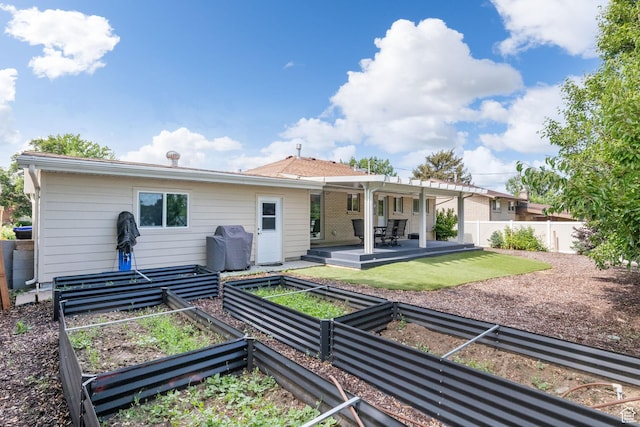149 E 800 N, Bountiful, UT 84010 - back of house with a vegetable garden and a patio area