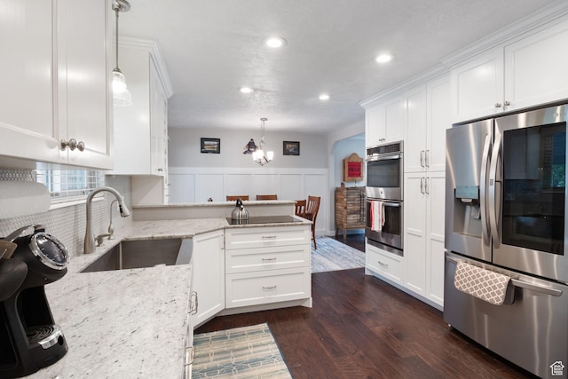 149 E 800 N, Bountiful, UT 84010 - kitchen featuring stainless steel appliances, a peninsula, white cabinetry, dark wood-style flooring, and recessed lighting