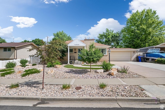 149 E 800 N, Bountiful, UT 84010 - view of front of home featuring brick siding and a garage