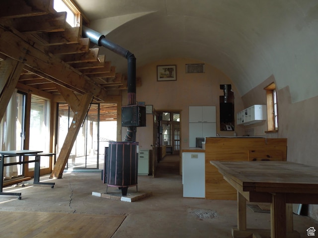 313 W Holyoak Ln, Castle Valley, UT 84532 - miscellaneous room with plenty of natural light, a wood stove, and vaulted ceiling